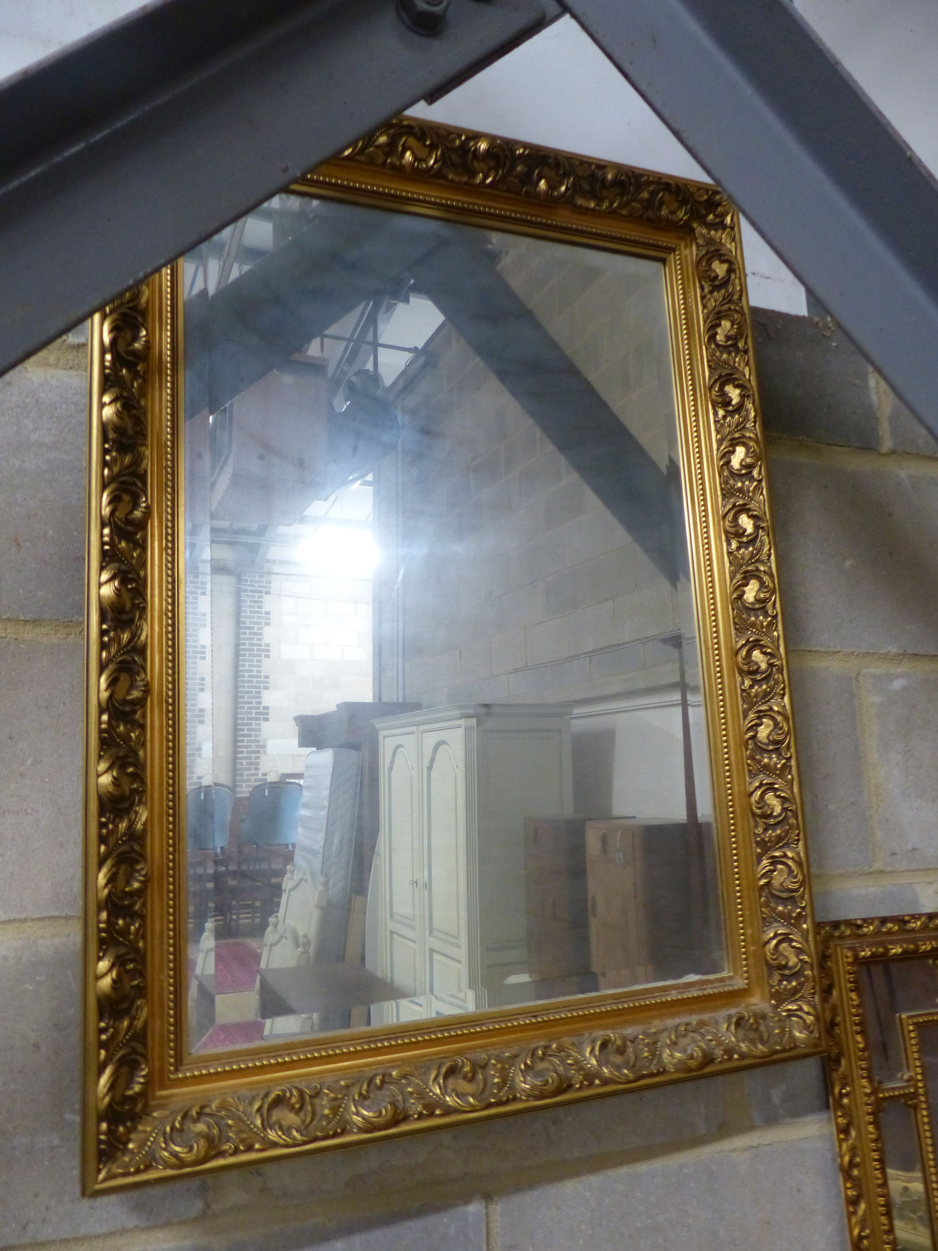 Three reproduction gilt framed wall mirrors, largest W.63cm H.85cm